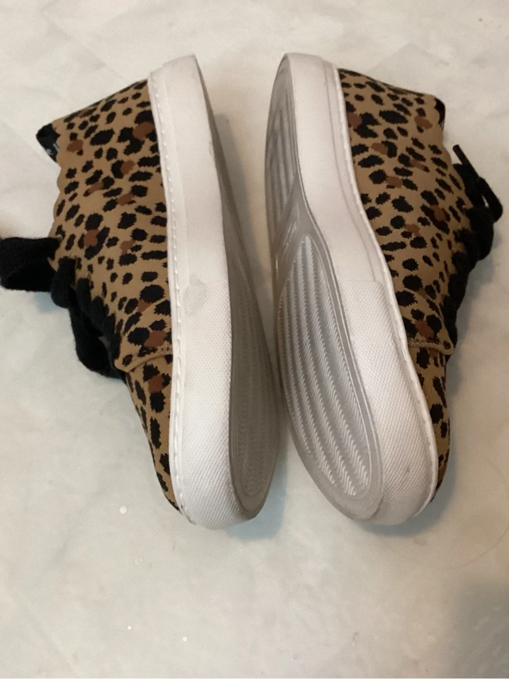 Kate Spade scallop leopard sneakers.